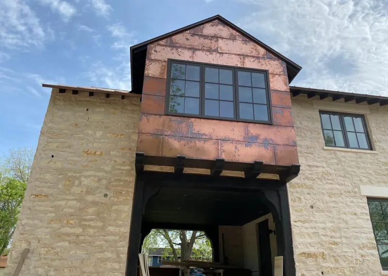 Copper metal panel facade on a stone building for Metal Roof Coating in Kalifornsky