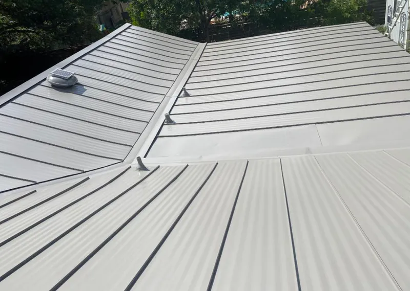 Solar attic fan installed on a metal roof for Roof Ventilation in Kalifornsky